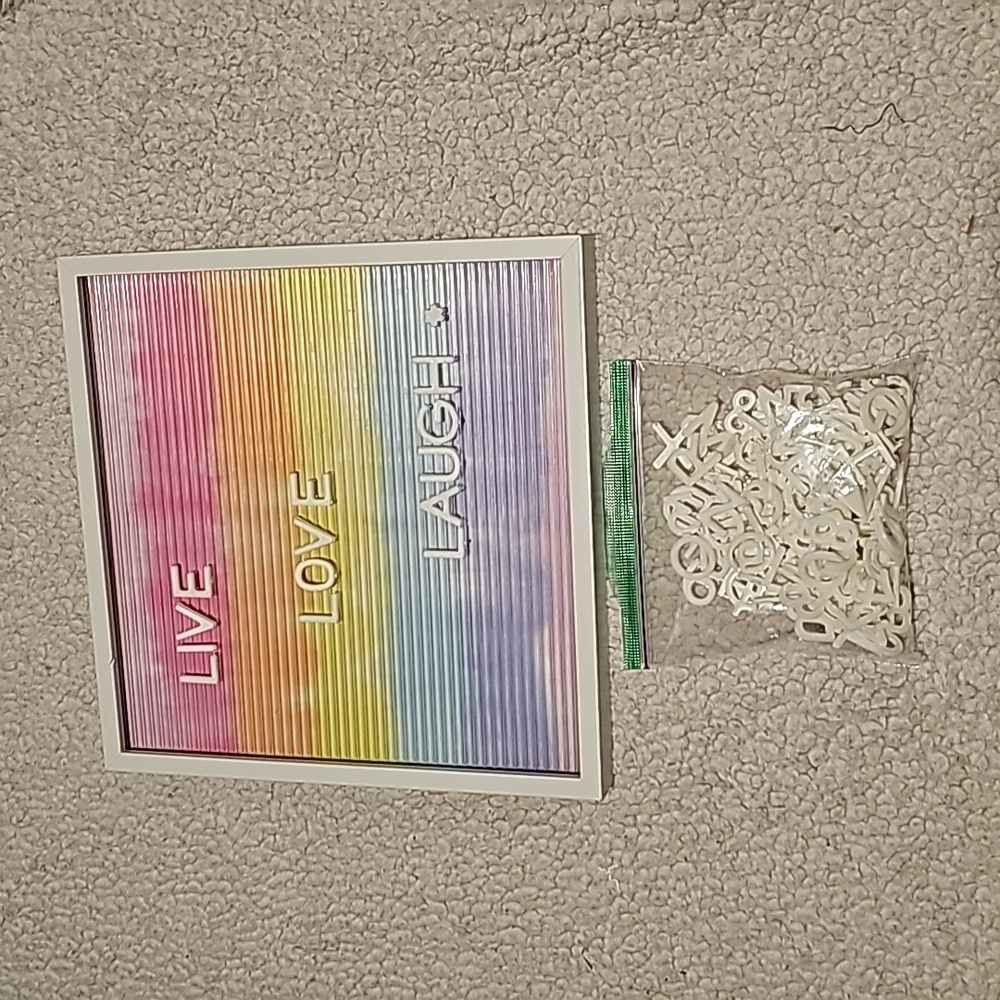 Letter board sign with inuded letters and symbols